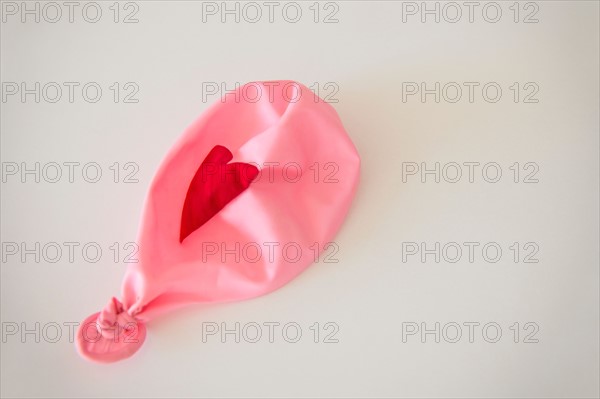 Studio Shot of deflated pink balloon