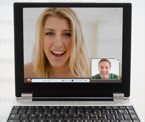 Man and woman chatting on computer