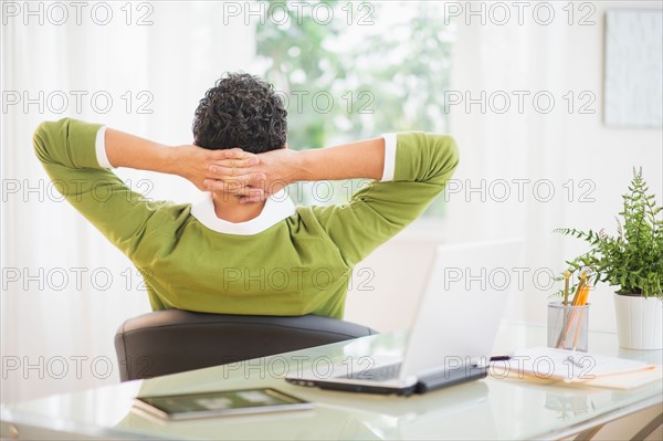 Rear view of man taking break from work