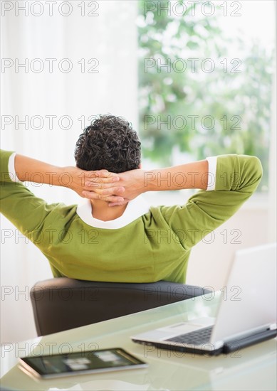 Rear view of man taking break from work