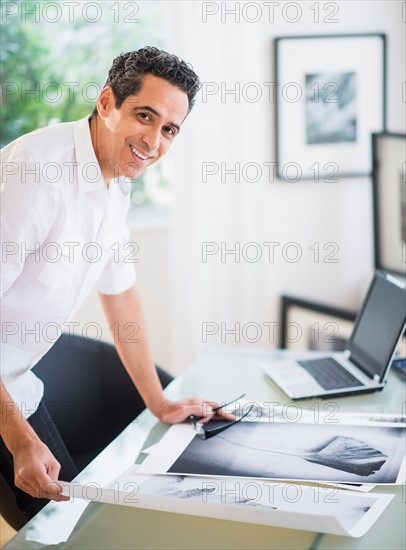 Portrait of man in his photography studio