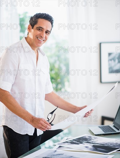 Portrait of man in his photography studio