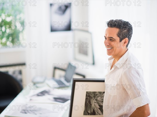 Portrait of man in his photography studio