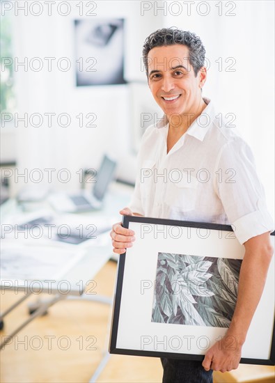 Portrait of man in his photography studio