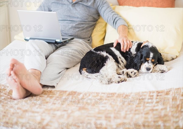 View of mature man using laptop at home