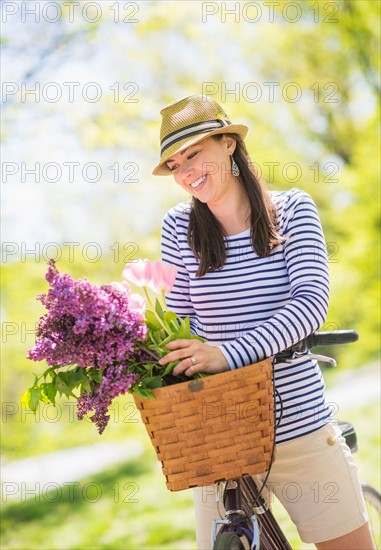 Portrait of mid adult woman riding bicycle