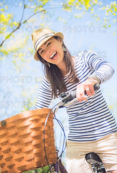 Portrait of mid adult woman riding bicycle