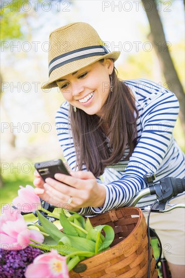 Mid adult woman using mobile phone