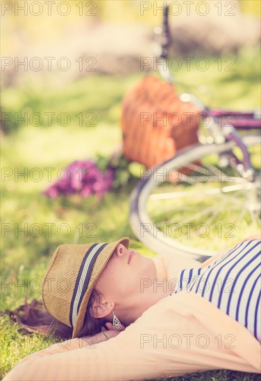 Portrait of mid adult woman relaxing in park