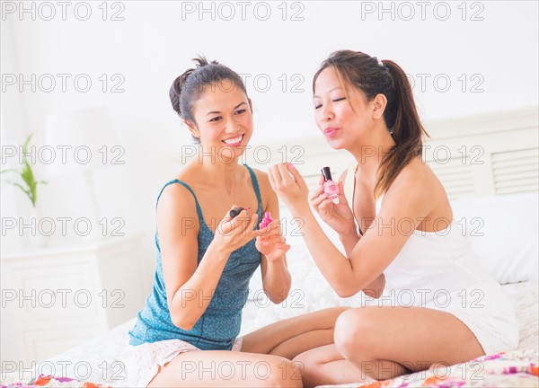 Two women doing manicure