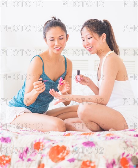 Two women doing manicure