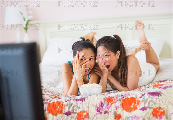 Two women watching tv