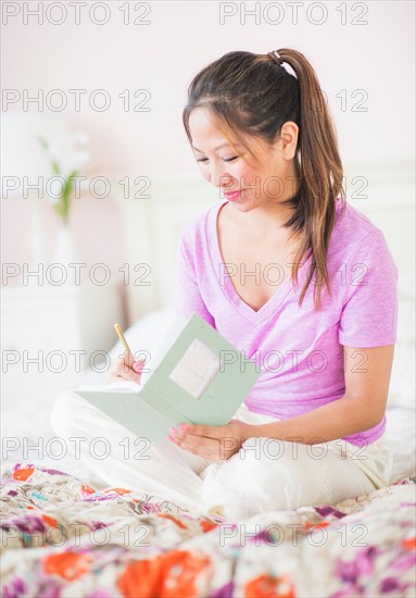 Young woman writing