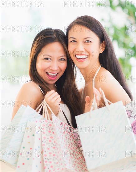 Portrait of two women with shopping bags