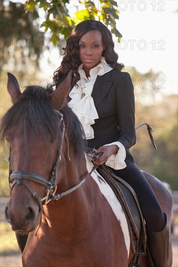 Beautiful woman horseriding