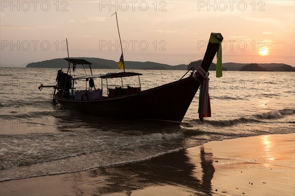 Traditional boat moored on beach