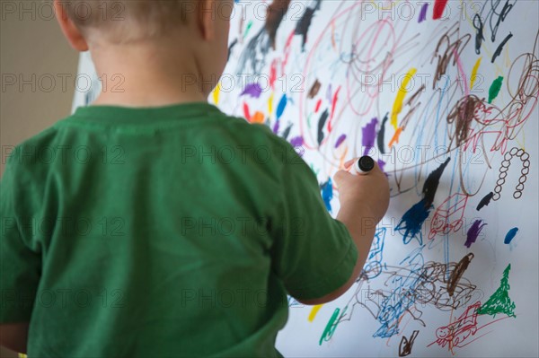 Toddler drawing on wall