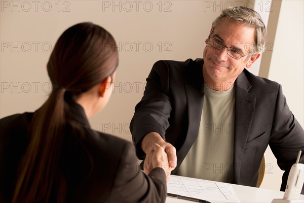 Mature man and woman working together