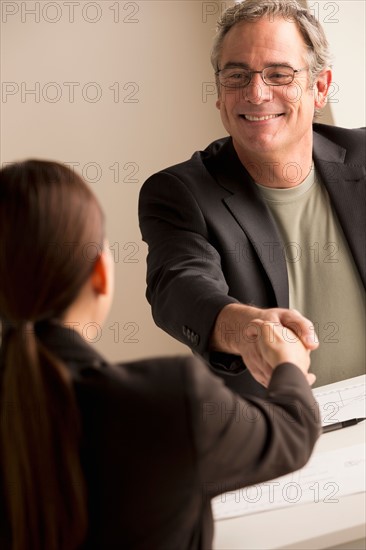 Mature man and woman working together