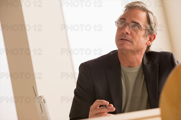 Mature man looking up