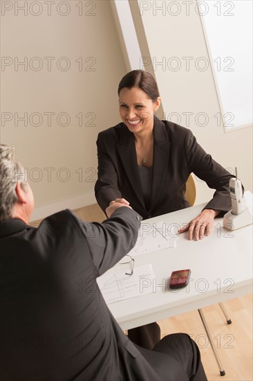 Mature man and woman working together