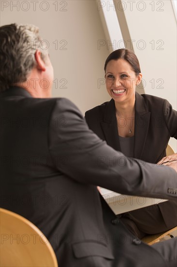 Mature man and woman working together