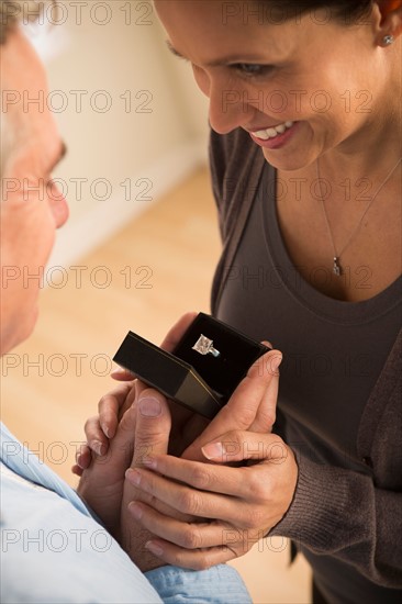 Mature man proposing to mature woman