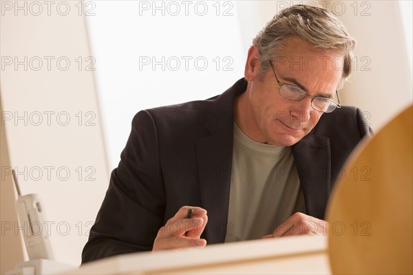 Mature business man concentrating on work