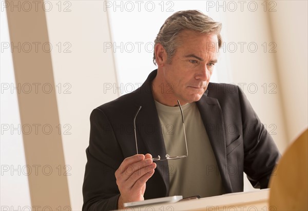 Mature business man concentrating on work