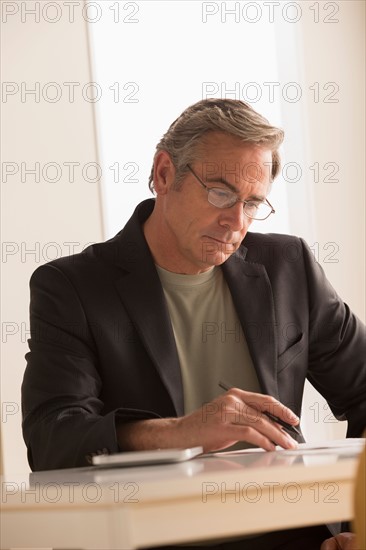 Mature business man concentrating on work