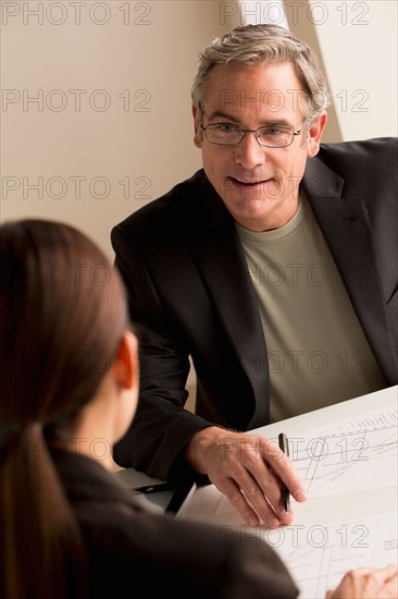 Mature man working with mature woman