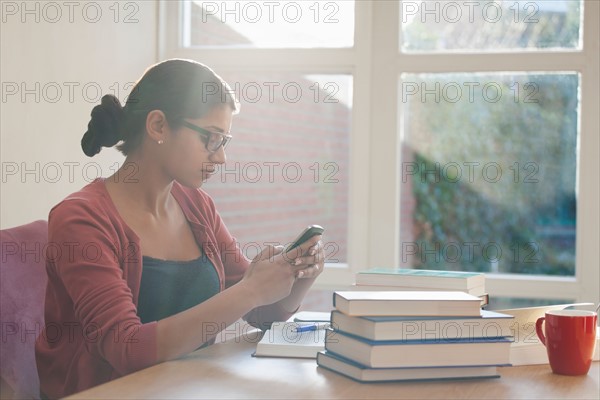 Young woman having coffee break during studying