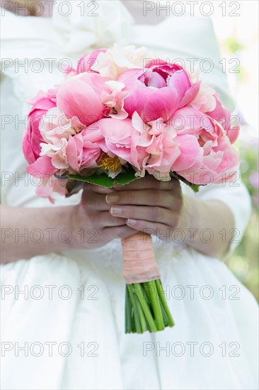 Bride with bouquet of pink flowers