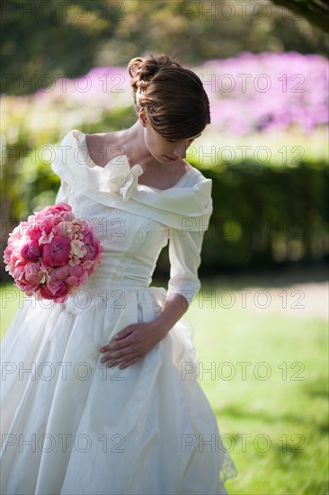 Bride with bouquet of pink flowers