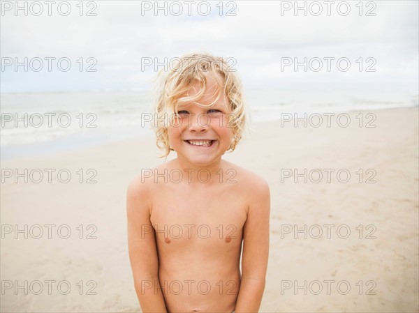 Portrait of boy (6-7) on beach