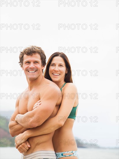 Couple embracing on beach