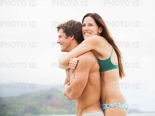 Couple embracing on beach