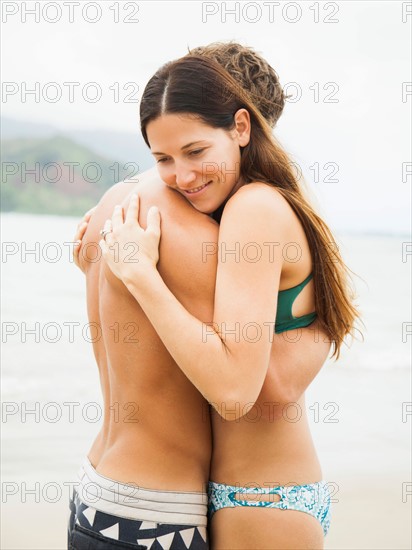 Couple embracing on beach