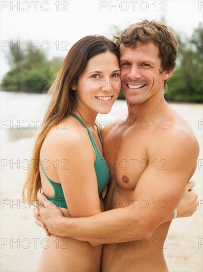 Couple embracing on beach