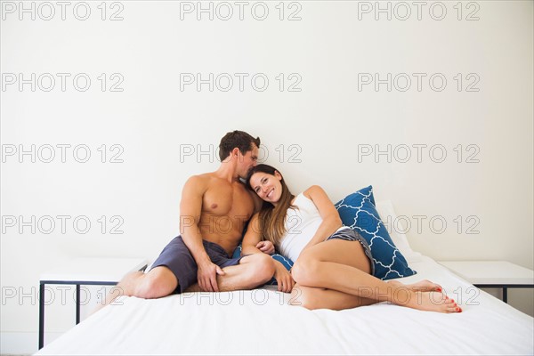 Couple lying on bed