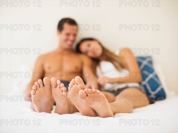 Couple lying on bed