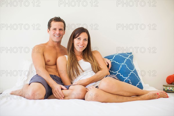 Couple lying on bed