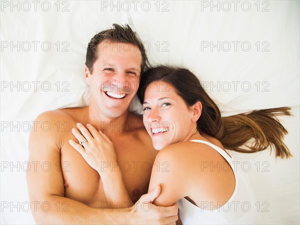 Couple lying on bed