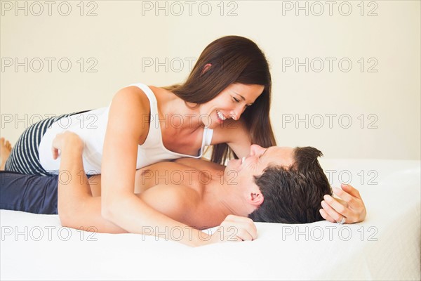 Couple lying on bed