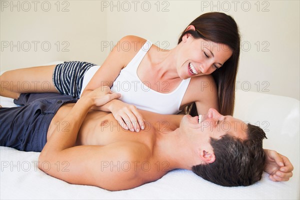 Couple lying on bed