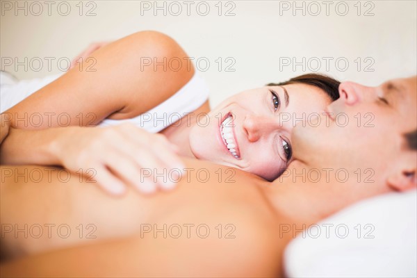 Couple lying on bed