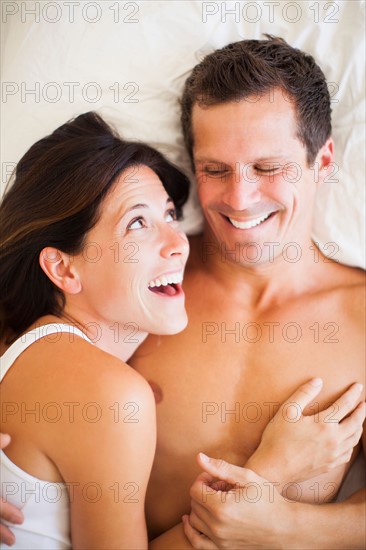 Couple lying on bed