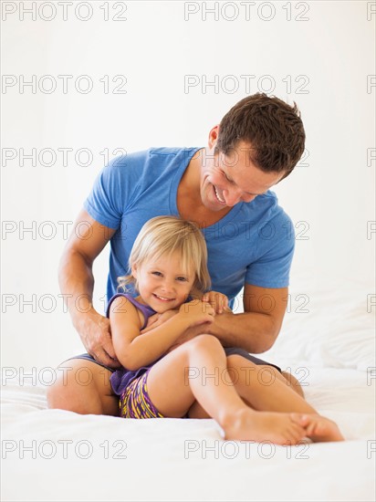 Father playing with daughter (2-3)