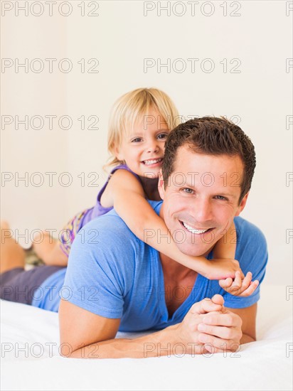 Father playing with daughter (2-3)