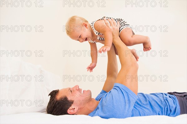 Man playing with baby boy (6-11 months)